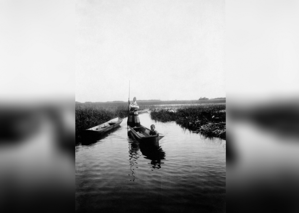 Seminole woman canoeing in the Everglades